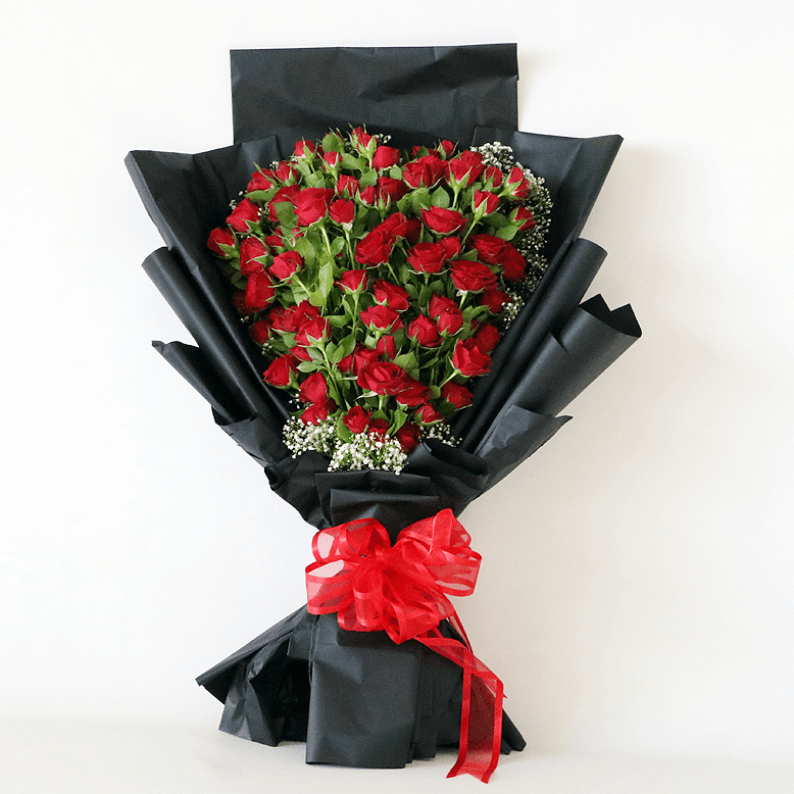 Red spray rose bouquet Red spray roses arranged in a heart shape with black paper
