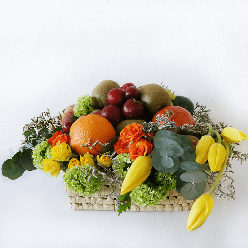 Deluxe Fruit Basket_2 Fruit basket with oranges, tulips, plums, kiwi and flowers