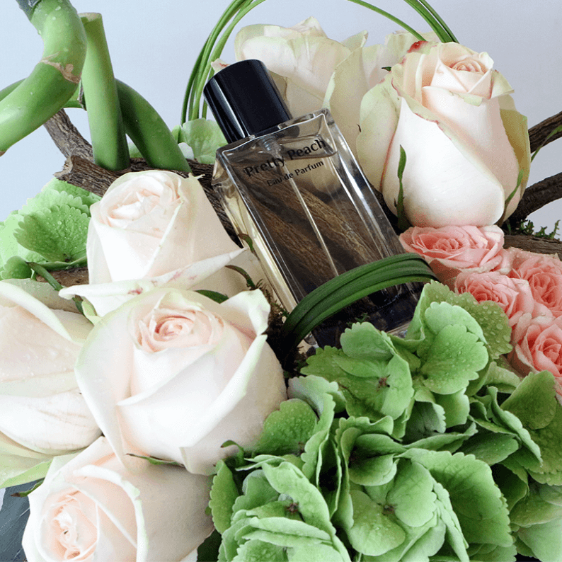 Pretty Peach Perfume Gift Design 2_1 close up of pretty peach perfume with green hydrangea and peach roses