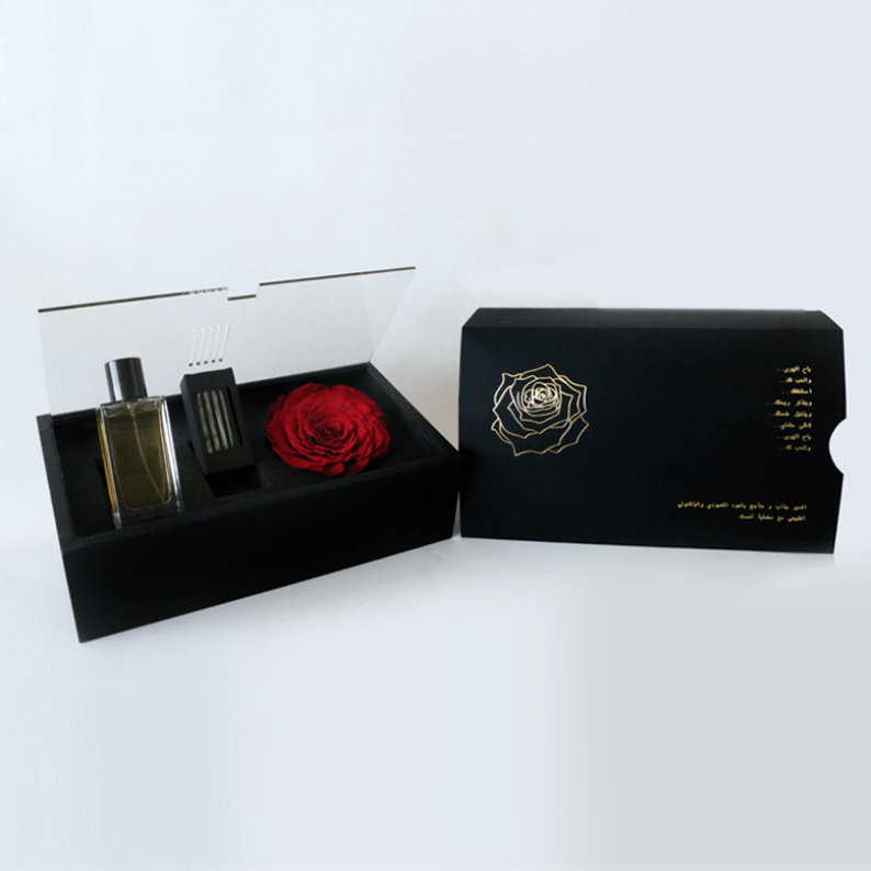 Revealing Red Perfume long lasting rose and Oud_2 revealing red perfume in a black box with Oud and a long lasting rose amor rose