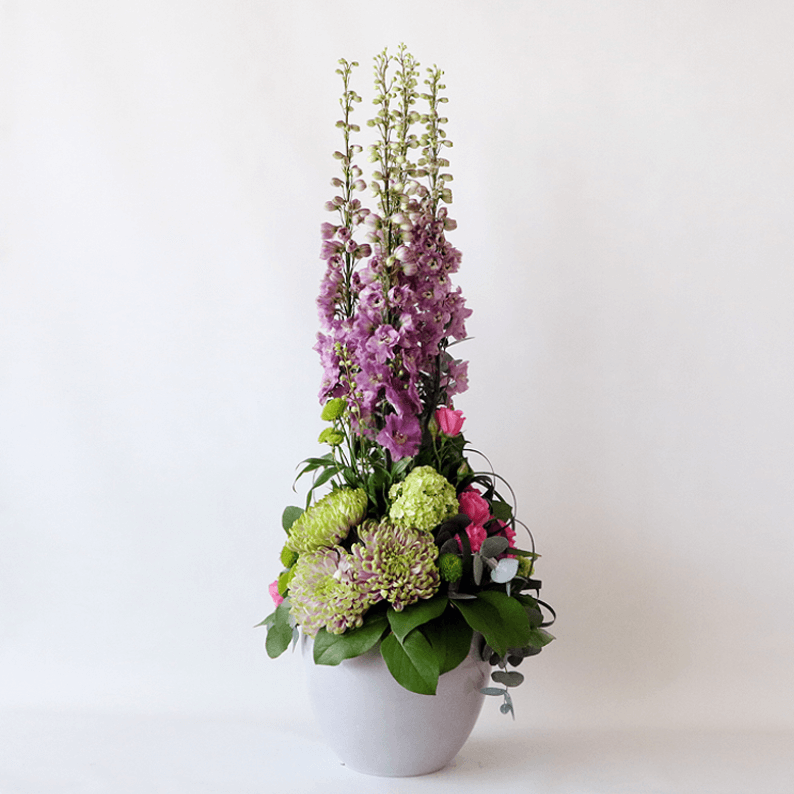 Weekly Flower Subscription 3 vases_2 Tall delphinium arrangement with greenery in a grey pot