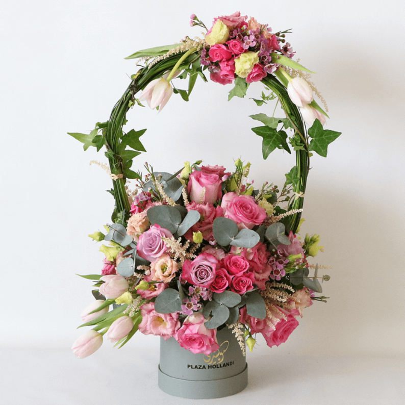 Plaza Hollandi box with pink flowers pink rose, eucalyptus, in a plaza hollandi box