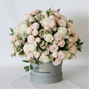 Valentine’s Day 8 peach and pink spray roses in a round design in a hat box