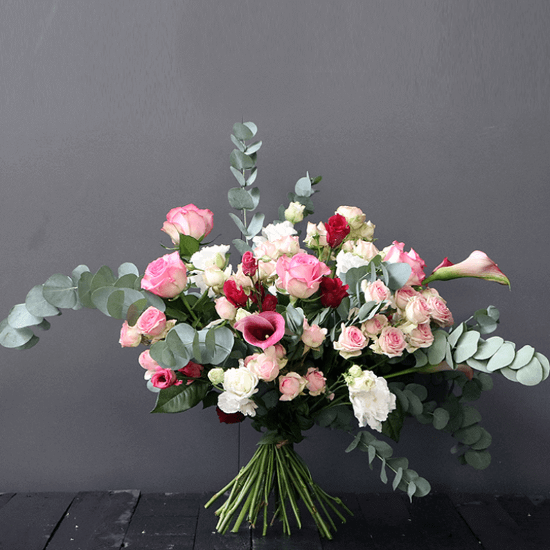 loose European style pink bouquet loose pink, white bouquet with calla lily, spray rose and eustoma