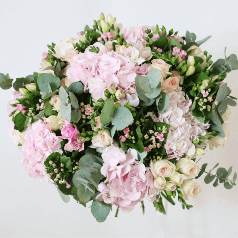 Wesley Ann hydrangea, spray rose, bouvadia and eucalyptus