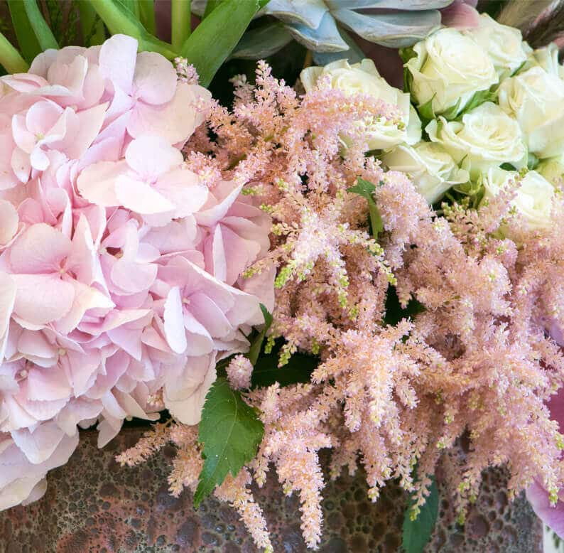 Mona Close up of pink and flower arrangement