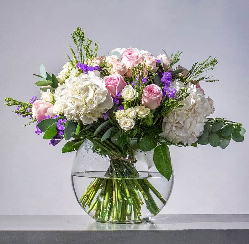 Moza Pink, purple and white bouquet in a vase
