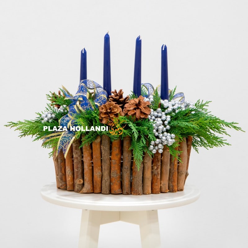 A green advent arrangement with four candles. A green advent arrangement with four candles.