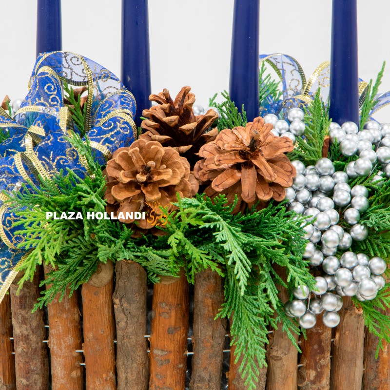A green advent arrangement with four candles. A green advent arrangement with four candles.