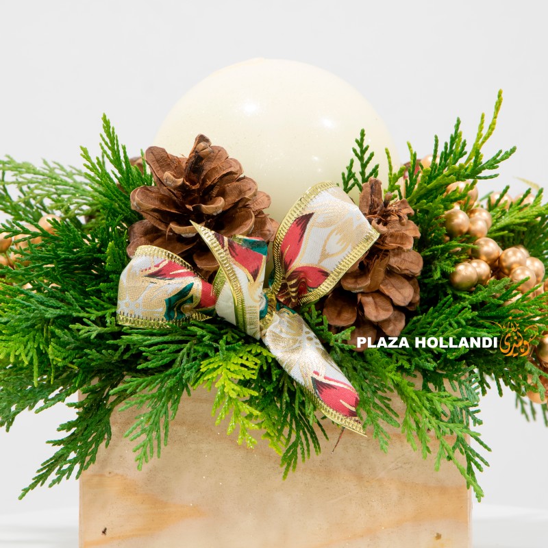 Festive arrangement with a large pillar candle Festive arrangement with a large pillar candle