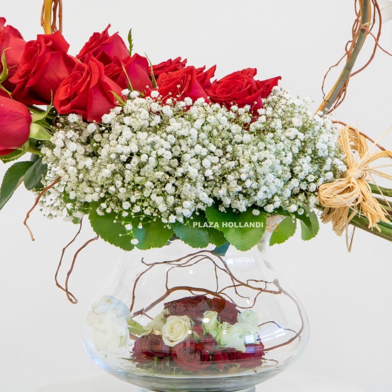 2.1 close up of gypsophelia, roses and a glass vase