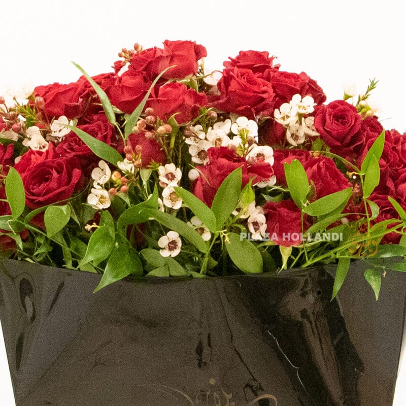Black box with spray rose 2 A black Plaza Hollandi bag with red spray roses and wax flower