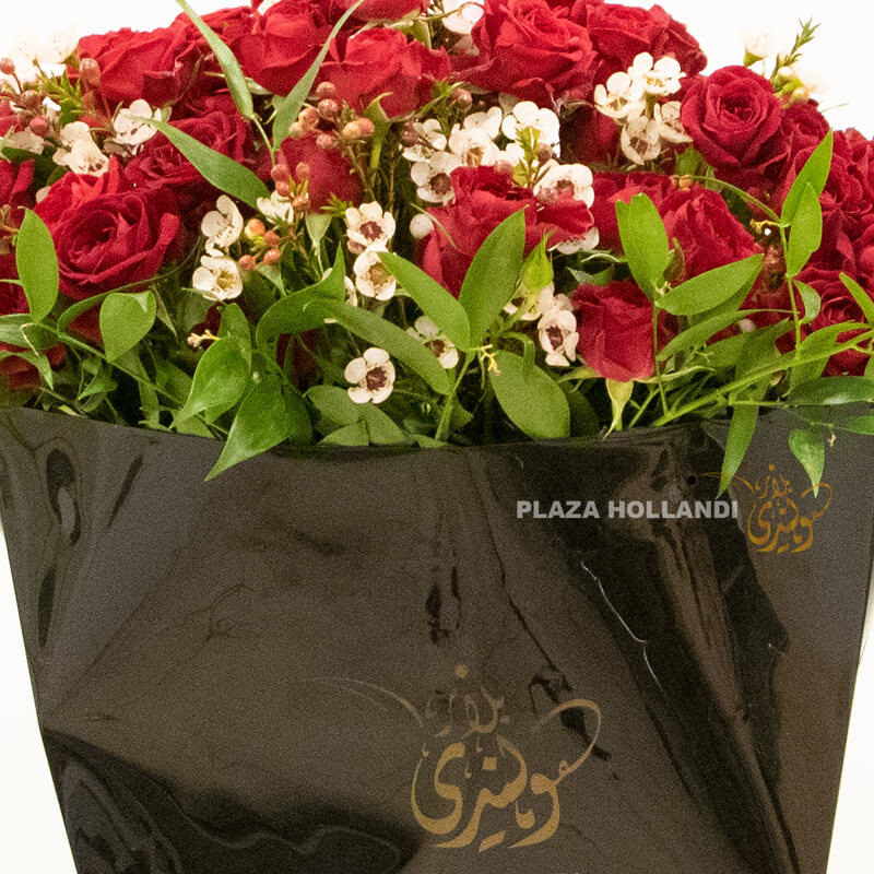 Black box with spray rose 3 A black Plaza Hollandi bag with red spray roses and wax flower