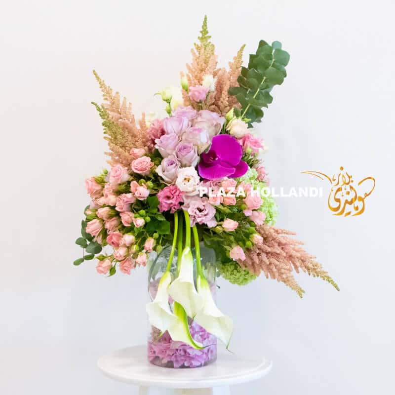 A12 A unique flower arrangement of pink and purple flowers