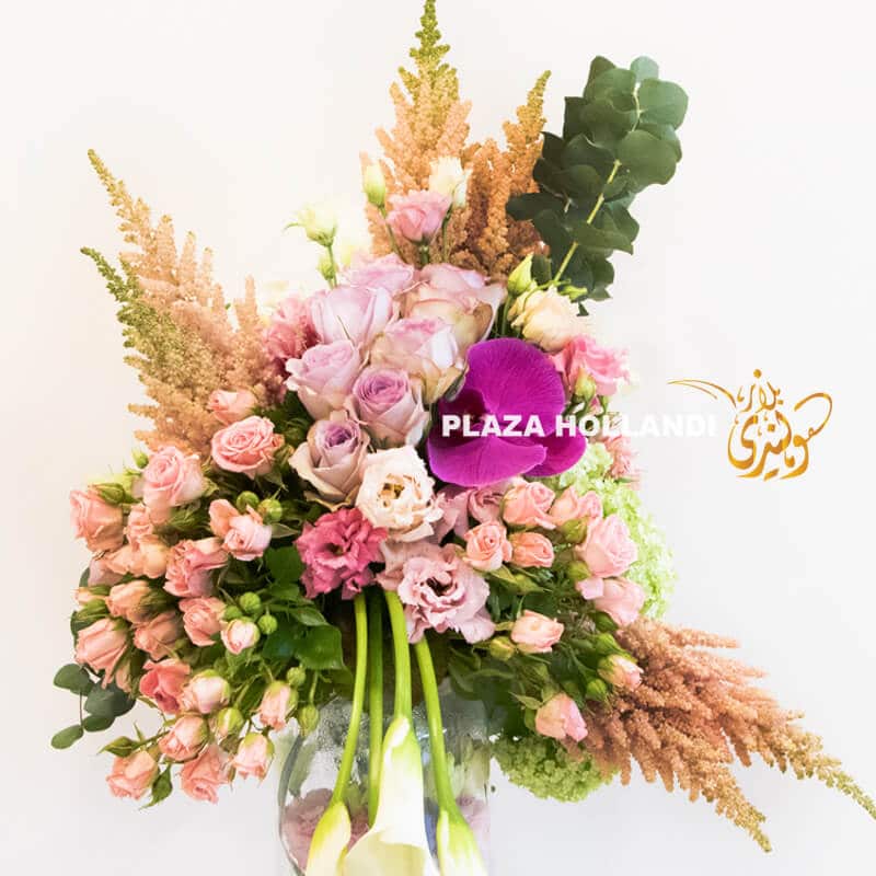 A14 A unique flower arrangement of pink and purple flowers