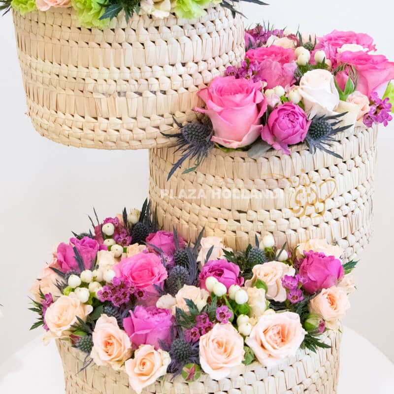 M 01 Close up of three baskets with pink and white flowers