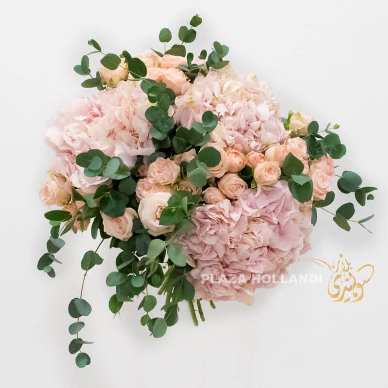 hydrangea bouquet Pink hydrangea bouquet with spray roses