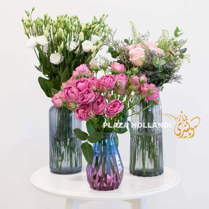 S06 Three vases full of flowers